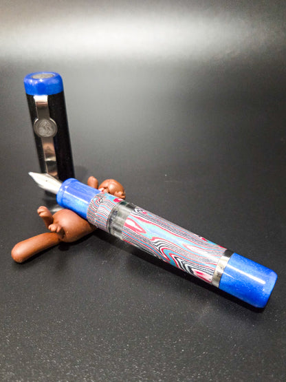 B46 - König - Crazy Fiber Faux Fordite - Piston Filler - Blue/Black trim